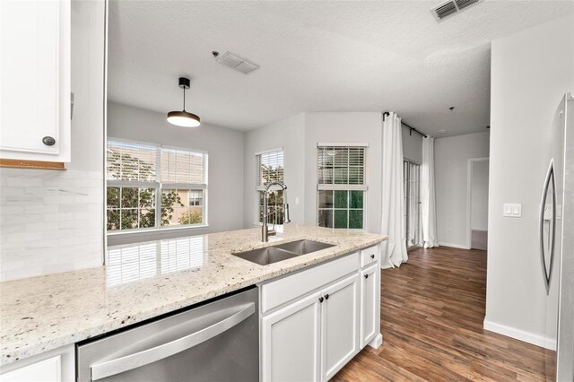 4897 Cypress Woods Dr Unit 6314, Orlando, FL 32811 - kitchen featuring stainless steel appliances, visible vents, a sink, and backsplash