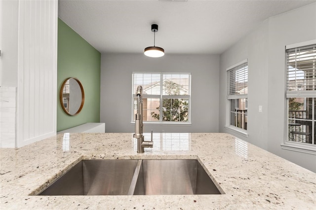 4897 Cypress Woods Dr Unit 6314, Orlando, FL 32811 - kitchen with a sink, decorative light fixtures, and light stone counters