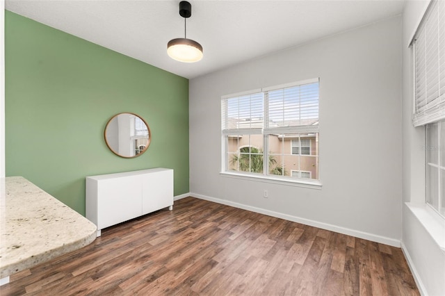 4897 Cypress Woods Dr Unit 6314, Orlando, FL 32811 - unfurnished dining area featuring wood finished floors and baseboards