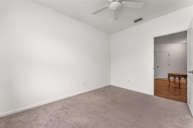 4897 Cypress Woods Dr Unit 6314, Orlando, FL 32811 - spare room with carpet floors, baseboards, a ceiling fan, and visible vents