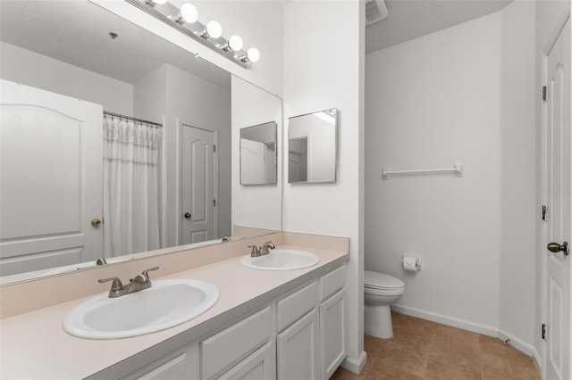 4897 Cypress Woods Dr Unit 6314, Orlando, FL 32811 - full bath featuring a sink, toilet, double vanity, and baseboards
