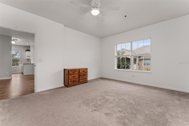 4897 Cypress Woods Dr Unit 6314, Orlando, FL 32811 - empty room featuring baseboards, ceiling fan, and carpet