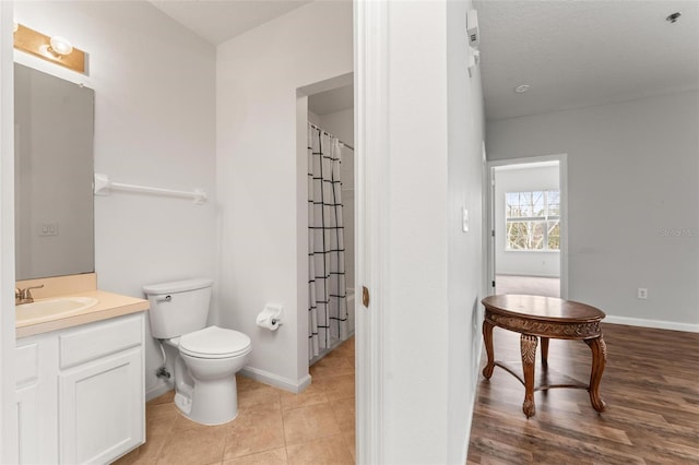 4897 Cypress Woods Dr Unit 6314, Orlando, FL 32811 - bathroom with toilet, vanity, and baseboards