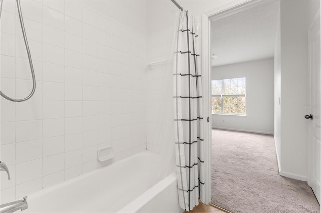 4897 Cypress Woods Dr Unit 6314, Orlando, FL 32811 - bathroom featuring shower / bath combo and baseboards