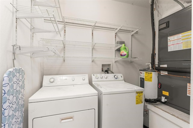 4897 Cypress Woods Dr Unit 6314, Orlando, FL 32811 - laundry area featuring water heater, independent washer and dryer, heating unit, and laundry area
