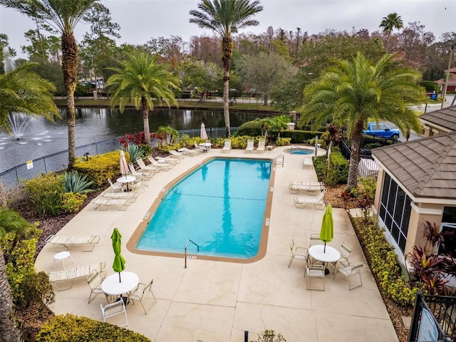 4897 Cypress Woods Dr Unit 6314, Orlando, FL 32811 - pool featuring a water view, a patio, fence, and a hot tub