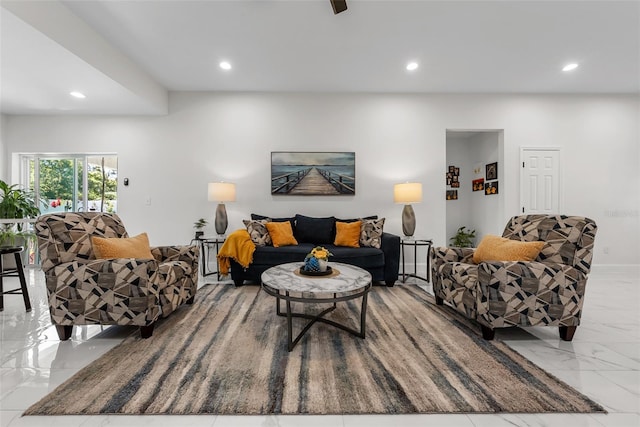 living room featuring recessed lighting and marble finish floor