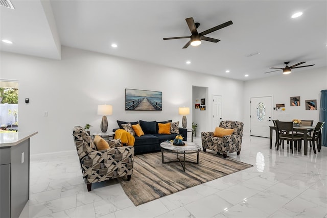 living room with baseboards, a ceiling fan, marble finish floor, and recessed lighting
