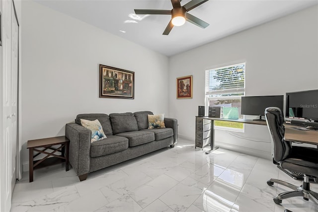office area featuring ceiling fan and marble finish floor