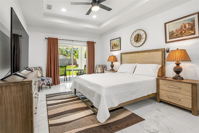 bedroom with access to outside, visible vents, recessed lighting, marble finish floor, and a raised ceiling