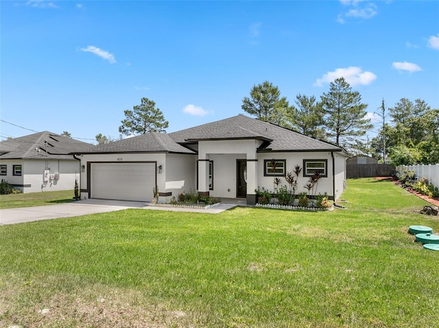 prairie-style home with concrete driveway, stucco siding, a front yard, a garage, and fence