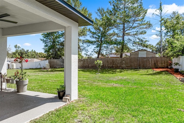view of yard featuring a patio and a fenced backyard