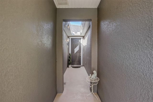 hall featuring visible vents