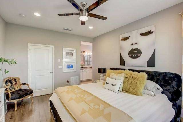 bedroom with visible vents, light wood finished floors, and recessed lighting