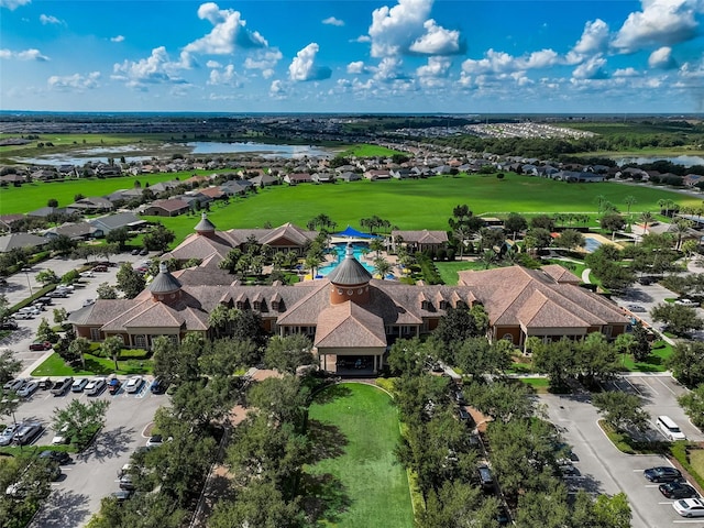 birds eye view of property featuring golf course view, a residential view, and a water view
