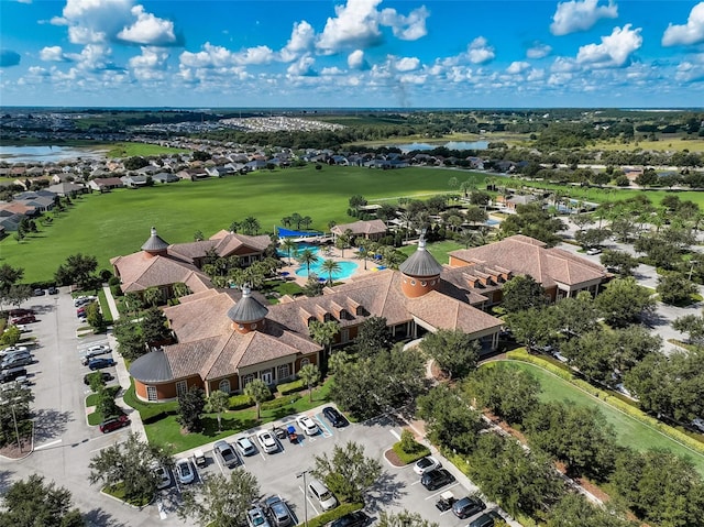 aerial view featuring a water view and view of golf course