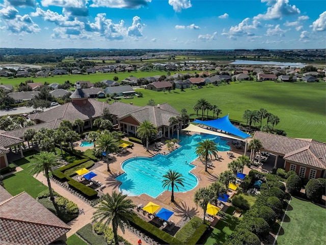 drone / aerial view featuring a water view and a residential view