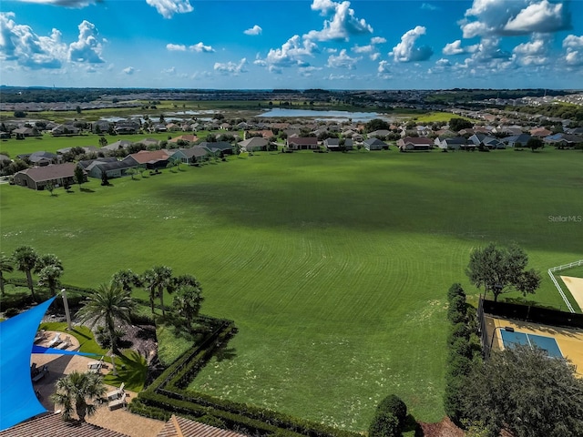 bird's eye view with a residential view and a water view