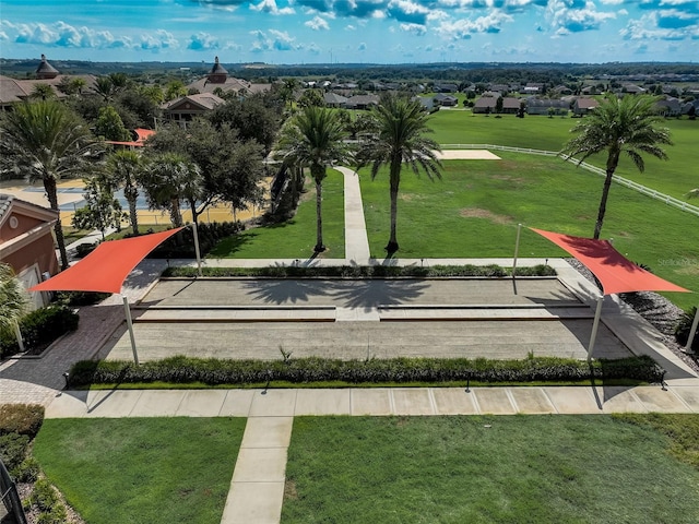 surrounding community with a yard