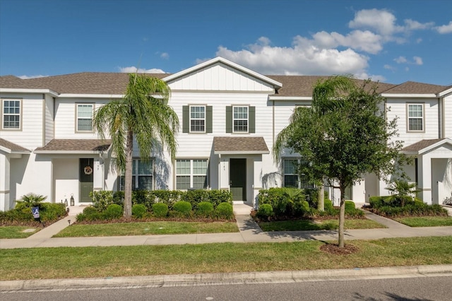 6165 Juneberry Way, Winter Garden, FL 34787 - townhome / multi-family property with board and batten siding and a shingled roof