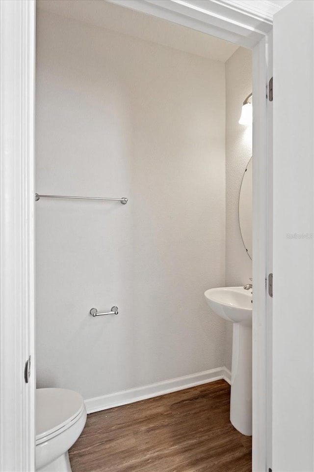 6165 Juneberry Way, Winter Garden, FL 34787 - half bathroom with toilet, wood finished floors, and baseboards