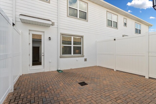 6165 Juneberry Way, Winter Garden, FL 34787 - back of property with a patio area, stucco siding, and fence