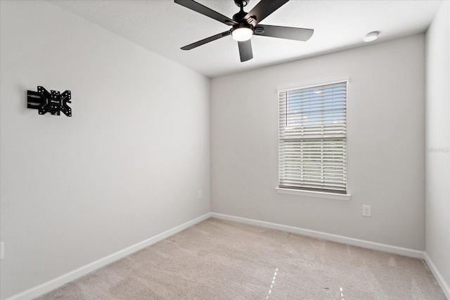 6165 Juneberry Way, Winter Garden, FL 34787 - spare room featuring baseboards, a ceiling fan, and light carpet