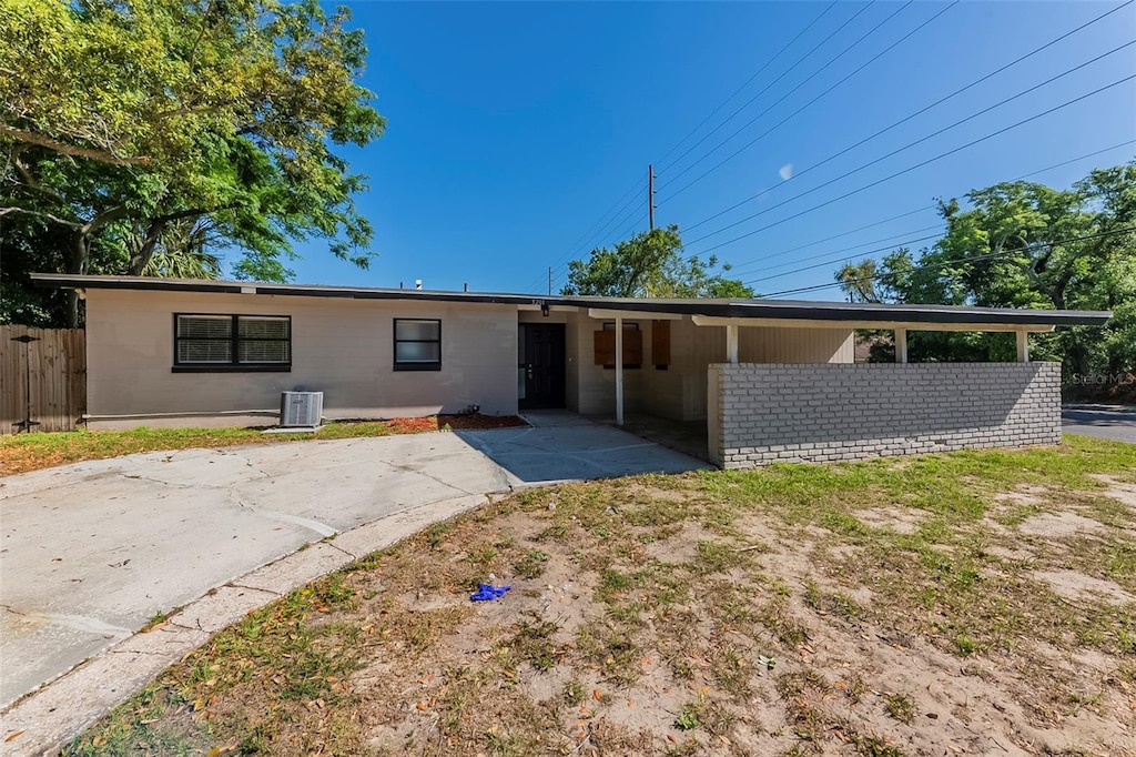 5201 Palisades Dr, Orlando, FL 32808 - rear view of house featuring fence, a patio, and central air condition unit
