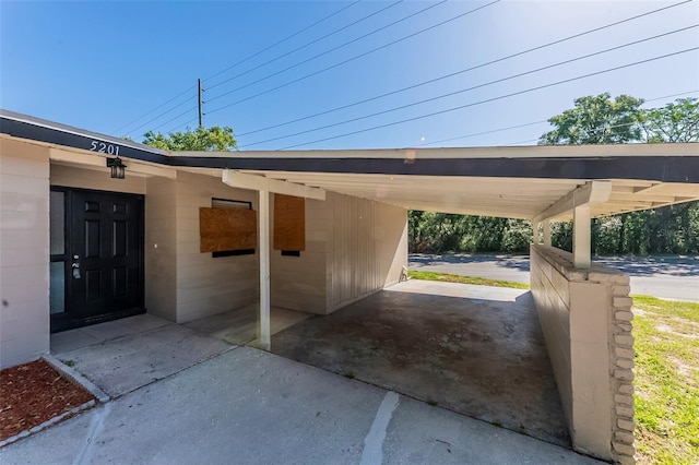 view of parking with an attached carport