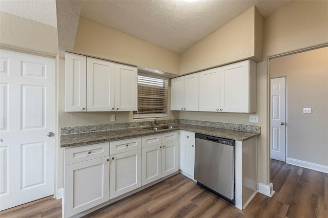 kitchen featuring stainless steel dishwasher, a sink, dark wood-style floors, and white cabinets