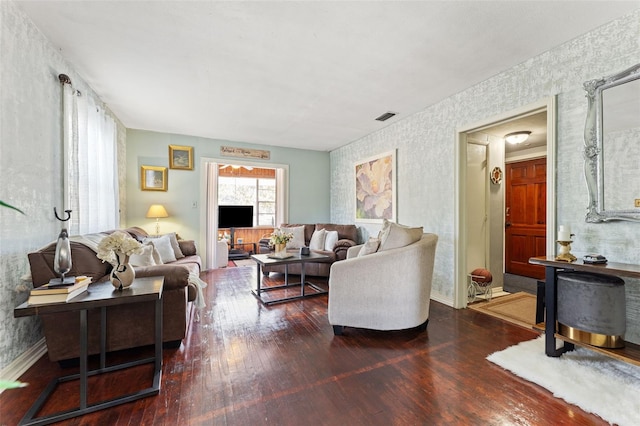1204 N Shore Dr, Jacksonville, FL 32208 - living room featuring wallpapered walls, visible vents, baseboards, and hardwood / wood-style floors