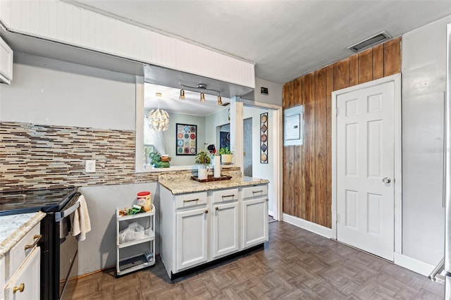 1204 N Shore Dr, Jacksonville, FL 32208 - bathroom featuring vanity, wooden walls, backsplash, and visible vents