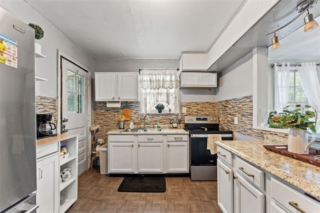 1204 N Shore Dr, Jacksonville, FL 32208 - kitchen with appliances with stainless steel finishes, decorative backsplash, a sink, and open shelves