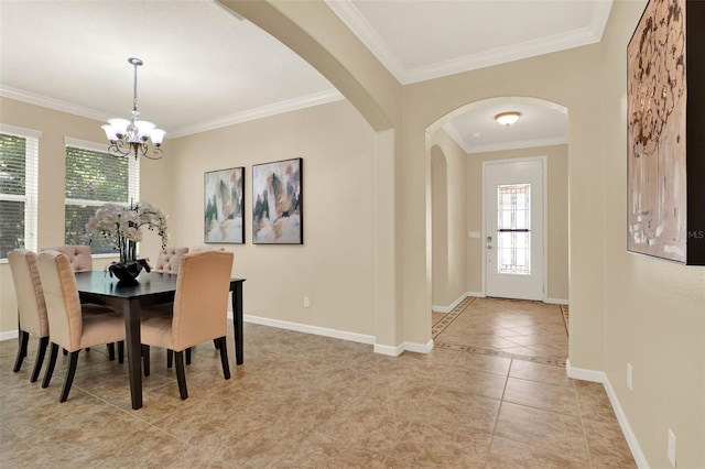 dining room featuring plenty of natural light, a notable chandelier, and ornamental molding