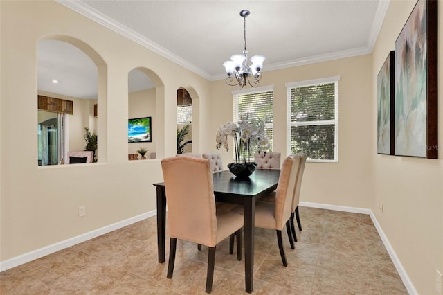 tiled dining area with crown molding, an inviting chandelier, baseboards, and arched walkways
