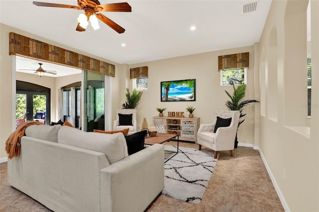 living area with recessed lighting, visible vents, baseboards, and ceiling fan