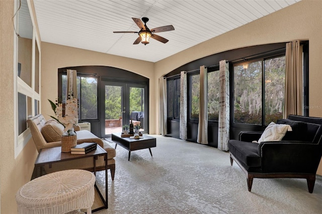 living room with french doors, a ceiling fan, carpet floors, and a healthy amount of sunlight