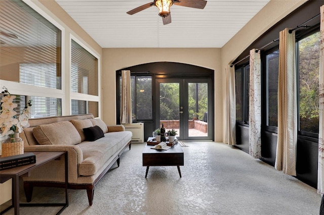 sunroom featuring french doors and carpet floors