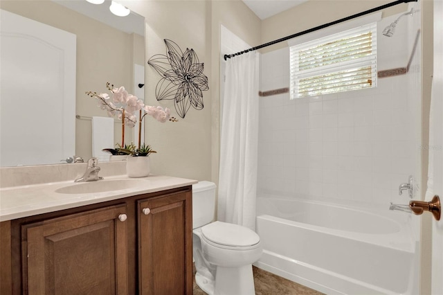 bathroom featuring shower / bath combo, toilet, and vanity