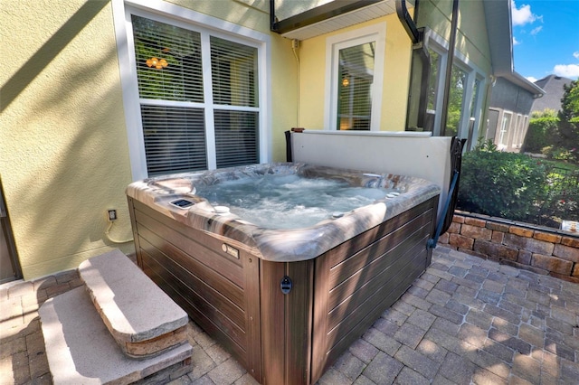 view of patio with a hot tub