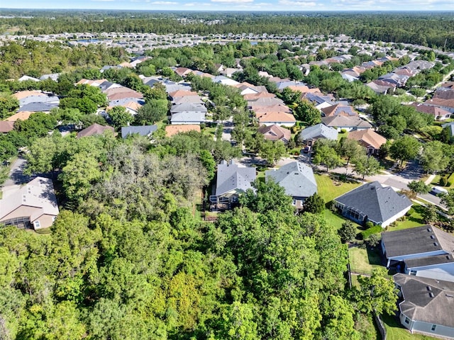 aerial view featuring a residential view and a forest view