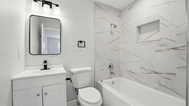 full bath featuring shower / bathing tub combination, a textured wall, toilet, and vanity