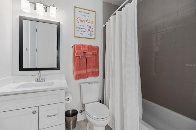full bath with toilet, vanity, and shower / tub combo with curtain