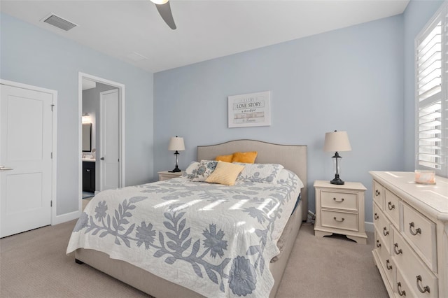 bedroom with visible vents, baseboards, ceiling fan, and light carpet