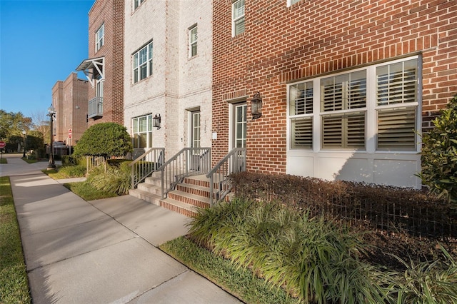 property entrance featuring brick siding