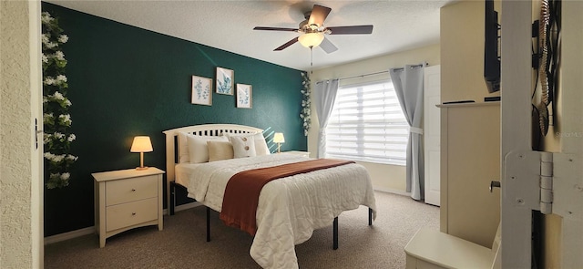 bedroom featuring baseboards, carpet flooring, and ceiling fan