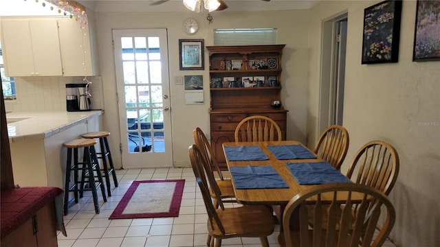 6639 Renaldo Way S, Saint Petersburg, FL 33707 - dining room featuring light tile patterned flooring and ceiling fan