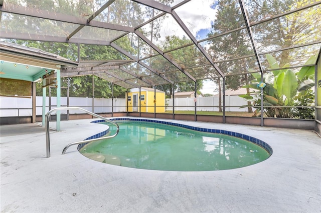 58 Barkwood Ln, Palm Coast, FL 32137 - view of swimming pool featuring a patio area, a fenced backyard, a storage unit, an outbuilding, and a fenced in pool