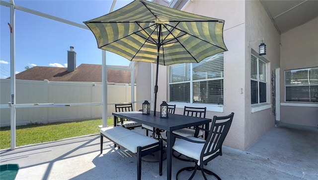 view of patio / terrace featuring outdoor dining space and fence