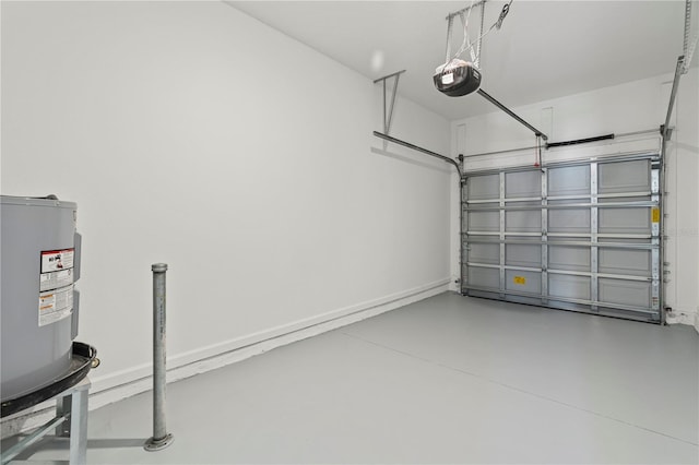 garage with a garage door opener and electric water heater